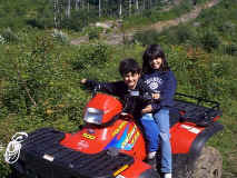 Kids sitting on ATV